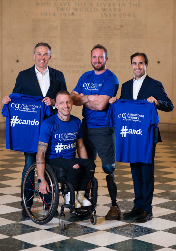 Two disabled athletes with two businessmen